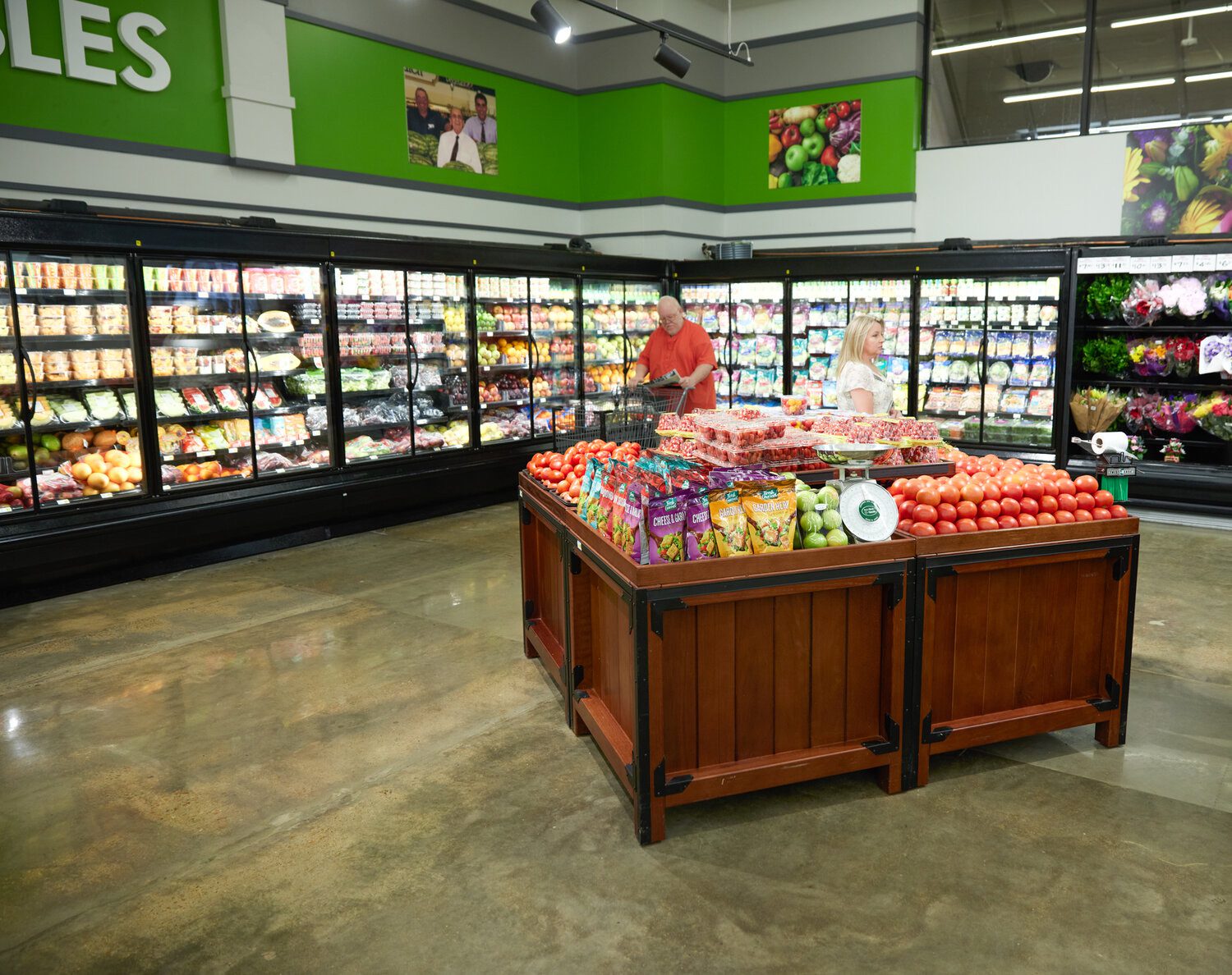 Fresh produce section and refrigerated display cases inside Naifeh's Food Stores.